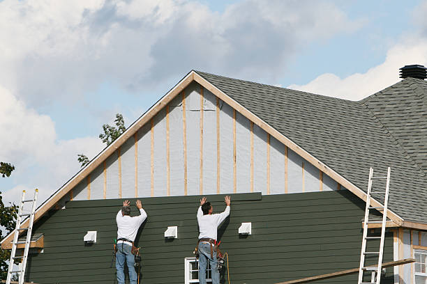 Professional Siding technician working in Babson Park, MA